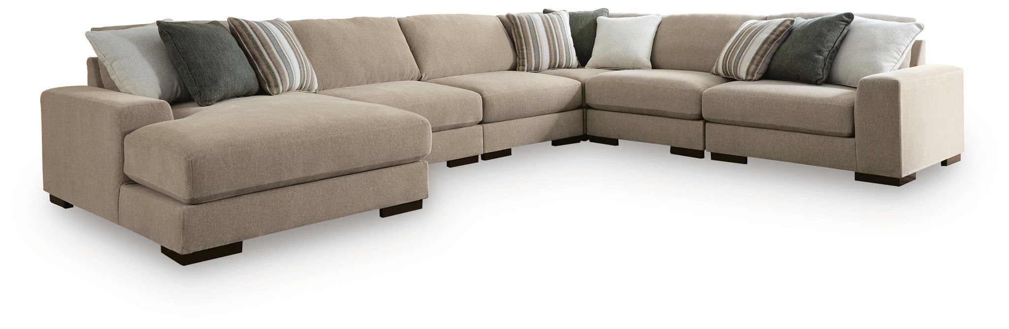Light brown sectional sofa with chaise and dark gray accent pillows, track arms