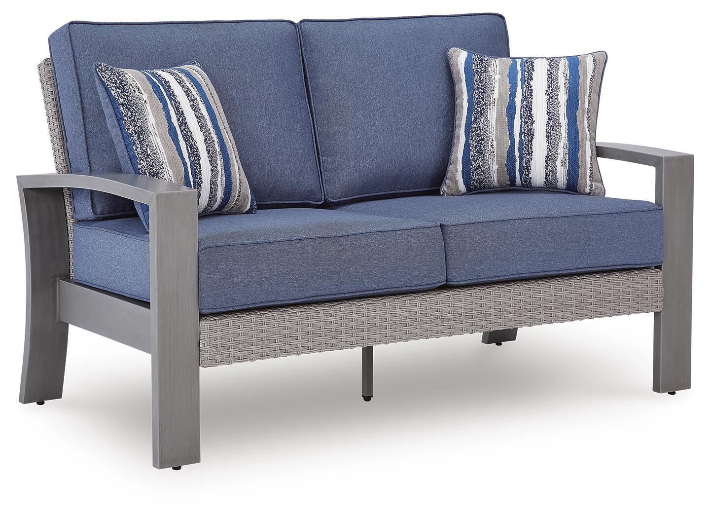 Blue-gray loveseat with gray base and two striped throw pillows