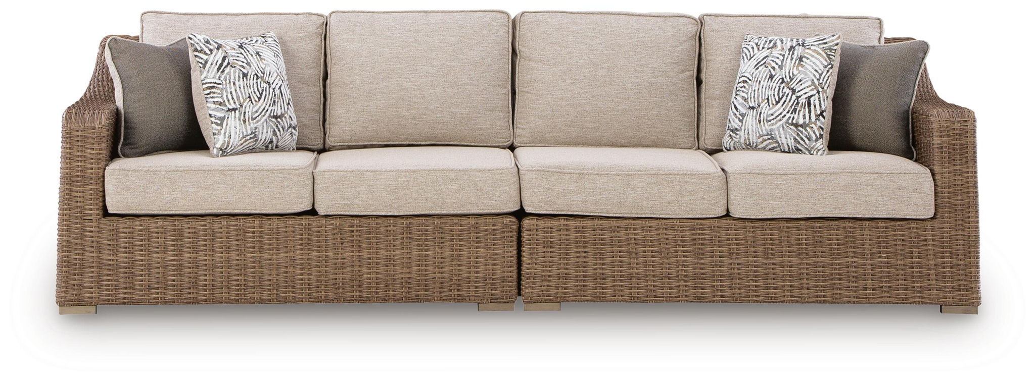 Beige loveseat with seat cushions and two patterned throw pillows, woven base.