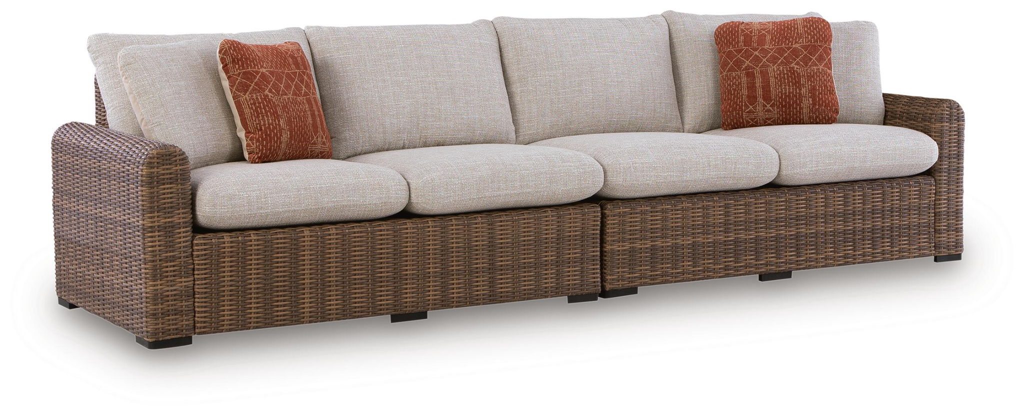 Beige and brown loveseat with two ottoman cushions and two patterned rust pillows
