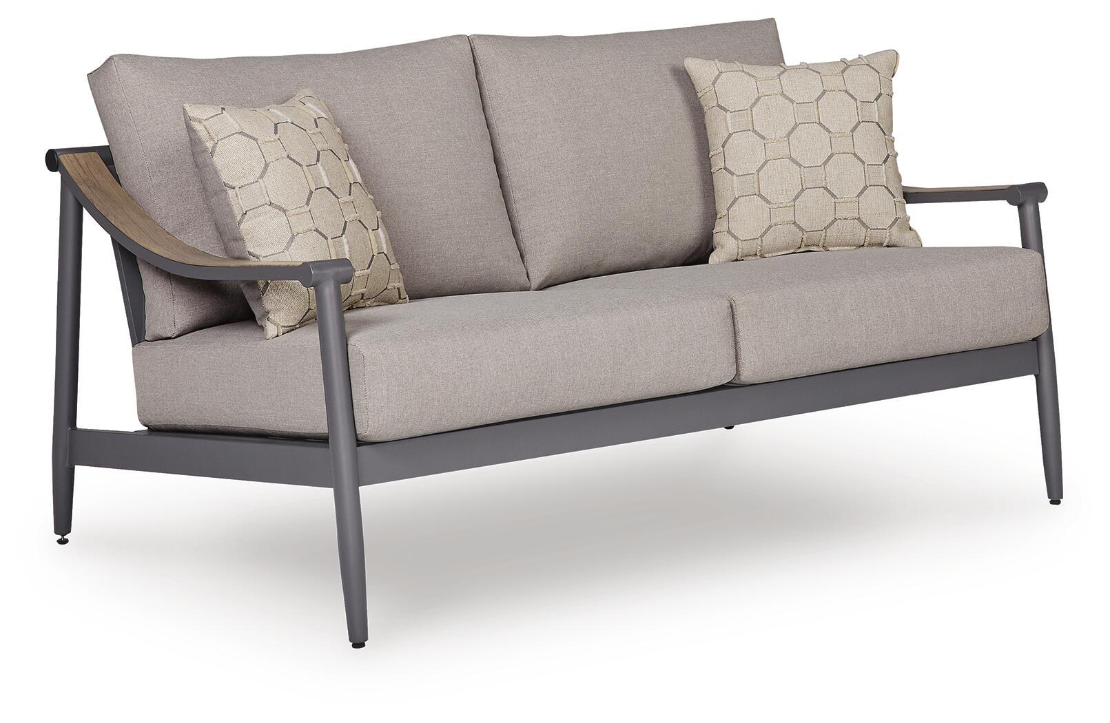 Gray loveseat with seat cushion and two patterned throw pillows