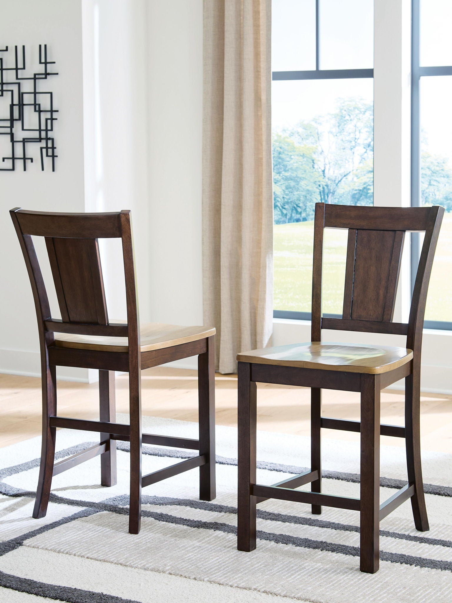 Pair of wooden barstools with dark brown backs and light brown seats, straight square legs
