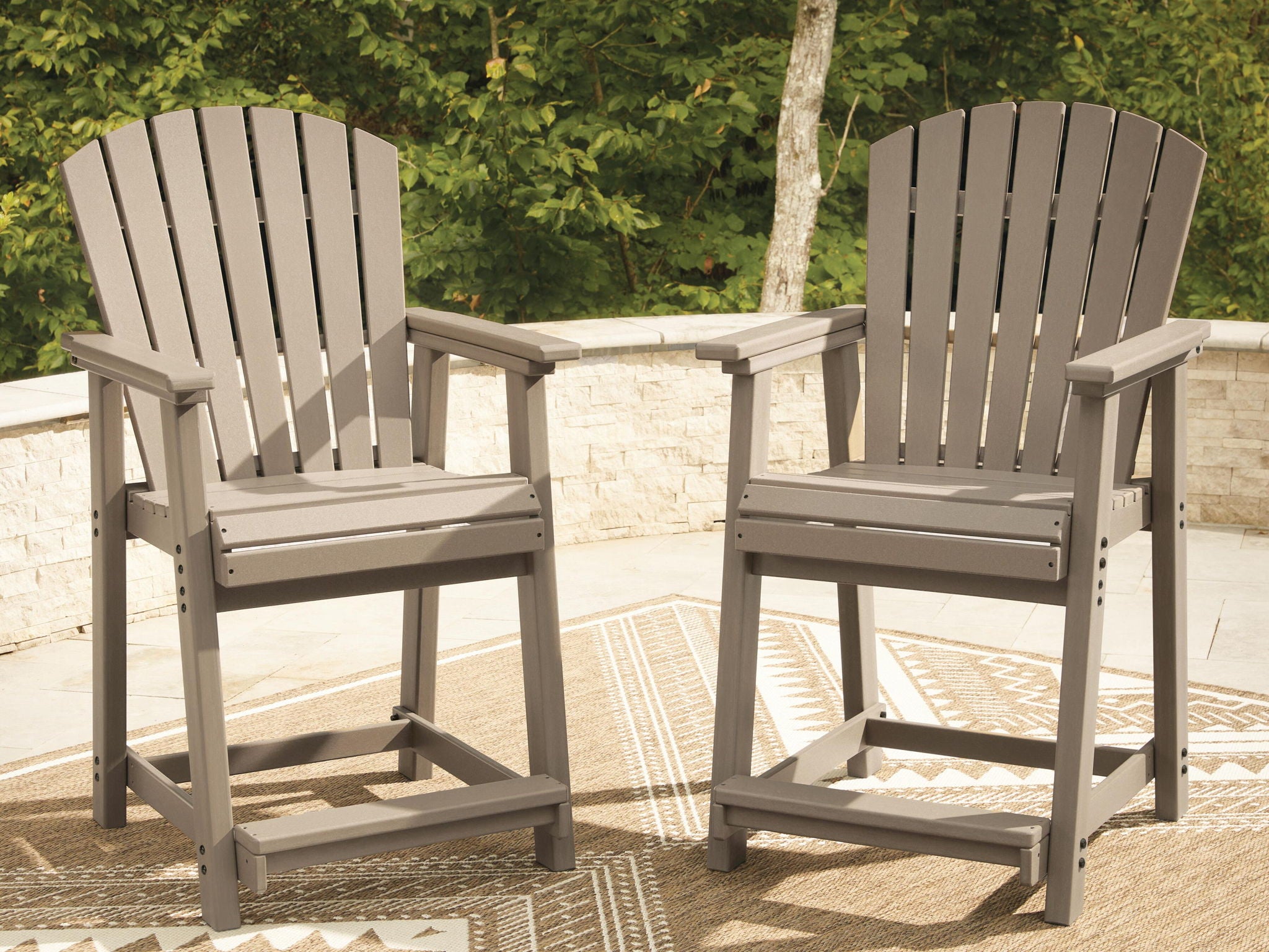 Pair of medium-brown Seacliff Beach barstools with slatted seats, backs, and armrests