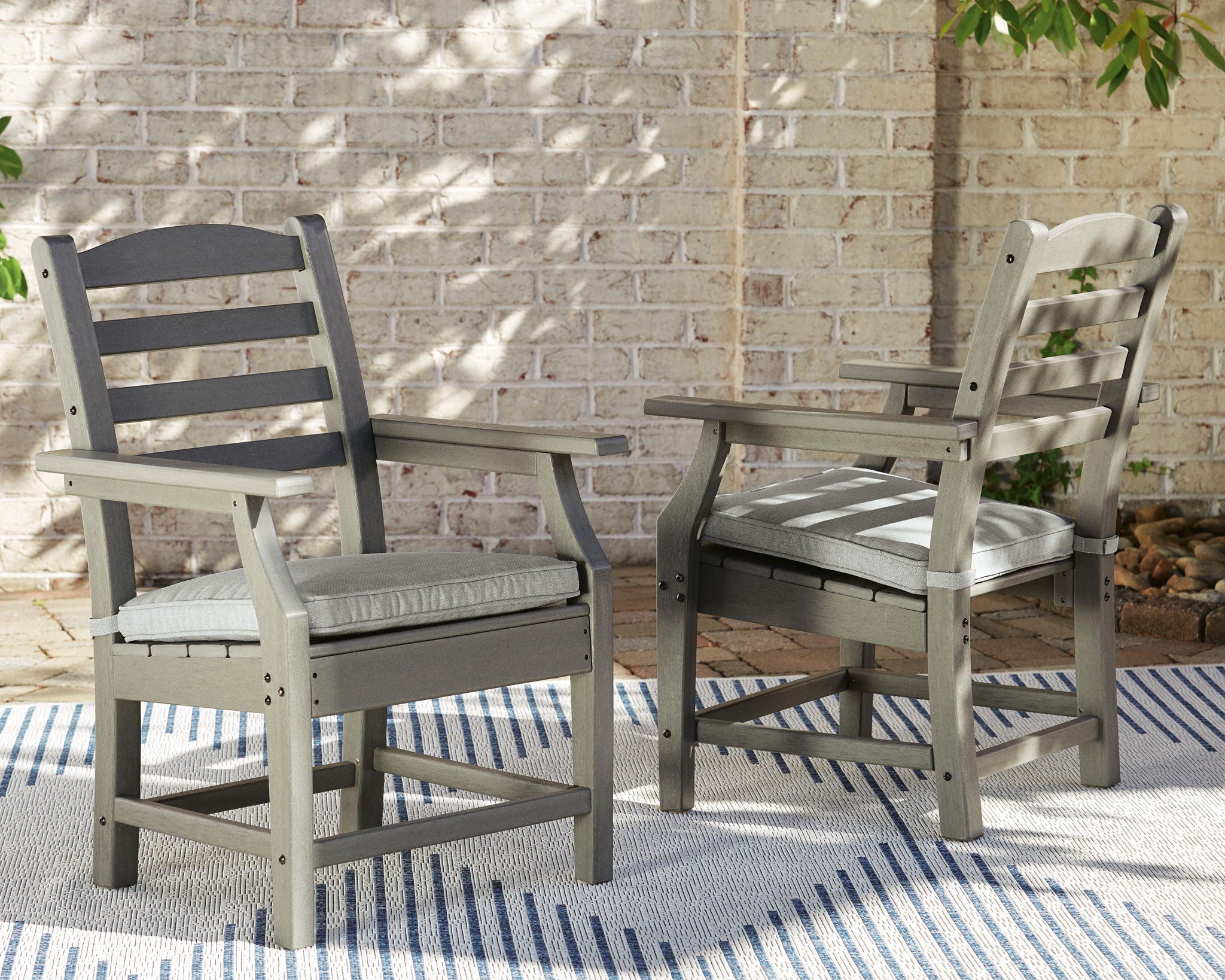 Gray armchairs set of 2 with cushioned seats and slatted backs