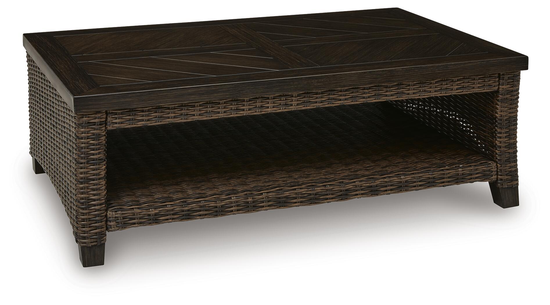 Dark brown rectangular table with woven wicker sides and open lower shelf