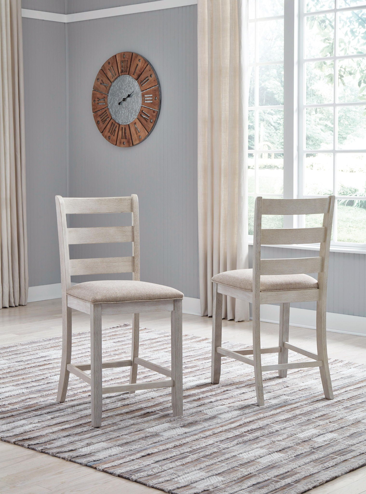 Upholstered barstool with beige padded seat and white ladder backrest, side view