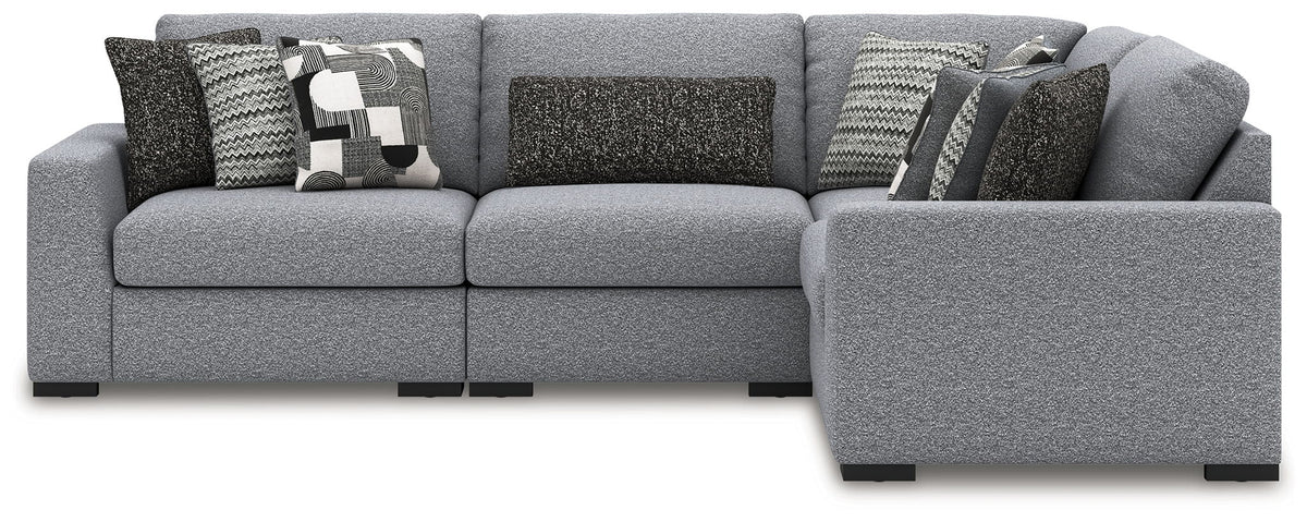Gray sectional sofa with corner chaise and patterned throw pillows