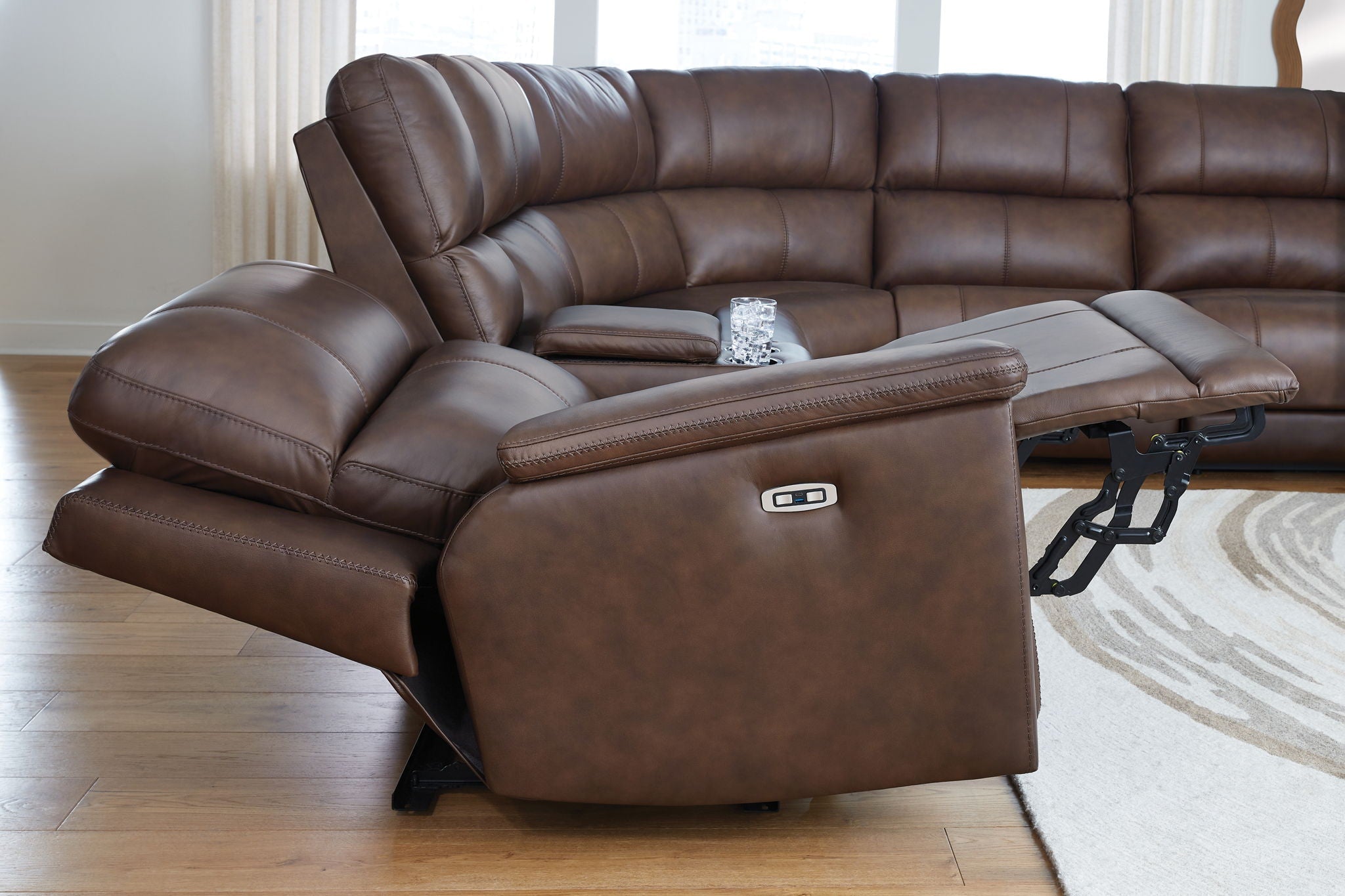 Brown reclining sectional chaise with power control and padded arm