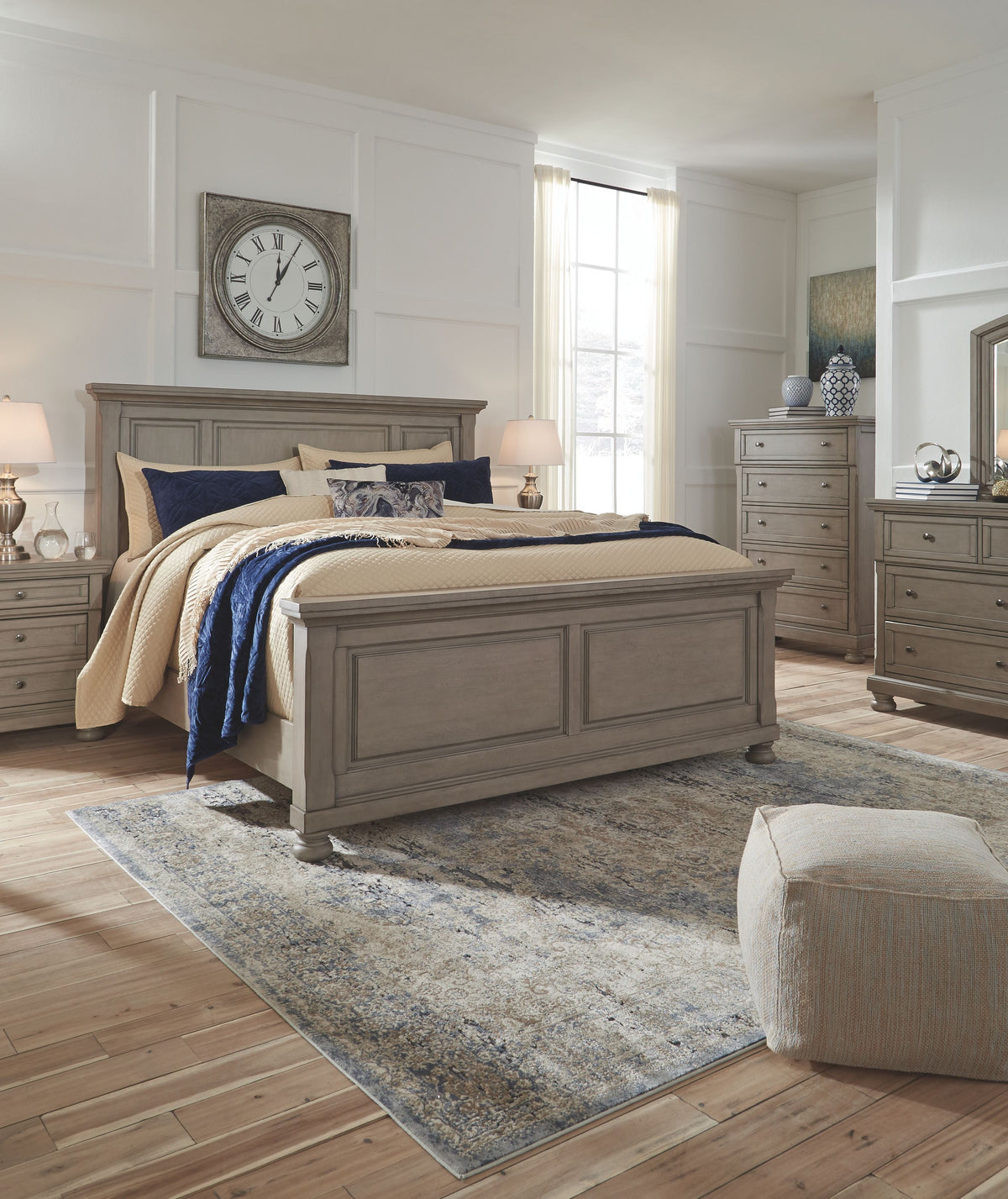 Gray panel bedroom bed with footboard and rails, styled with blue and cream bedding