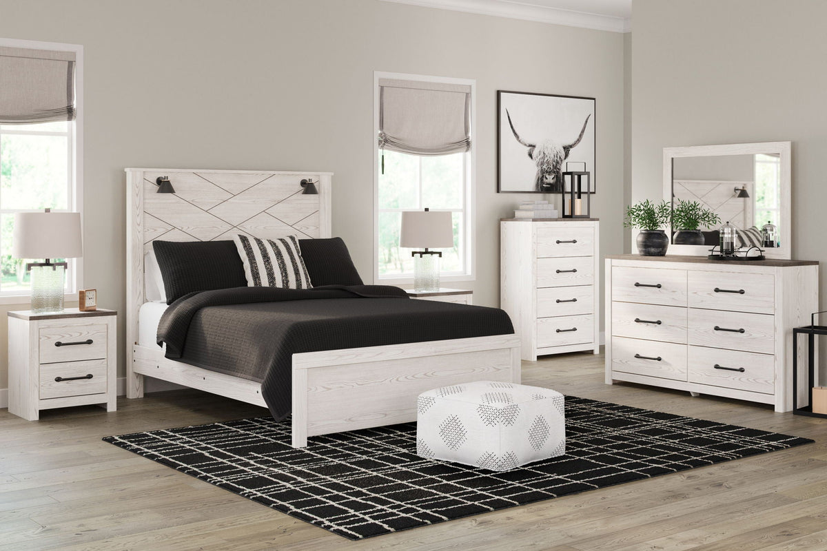 White panel bedroom set with bed, nightstands, dresser, and mirror
