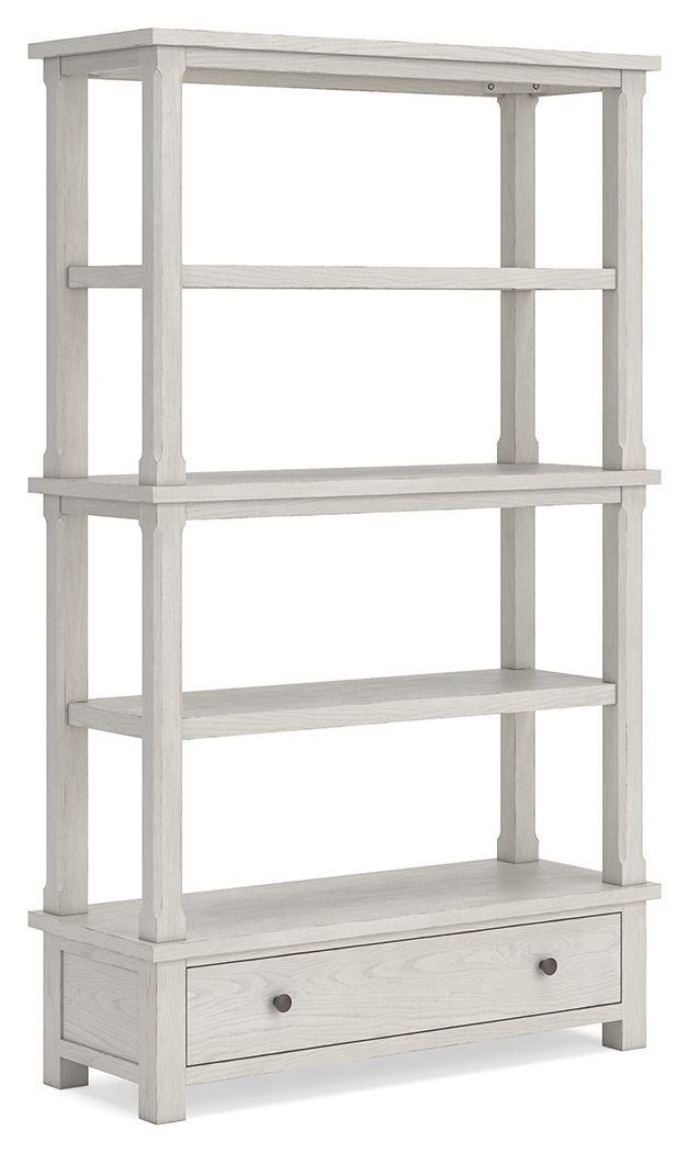 Antique white tall bookcase with open shelves and a bottom drawer.