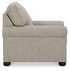 Upholstered armchair with high back, wide seat, and dark wood legs