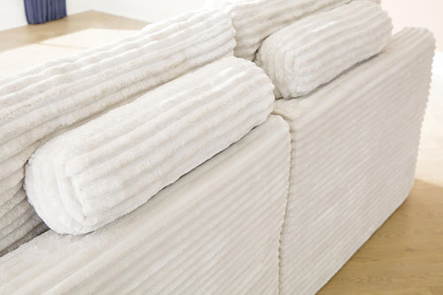 Ivory corner chair armrest with striped upholstery and thick seat cushion