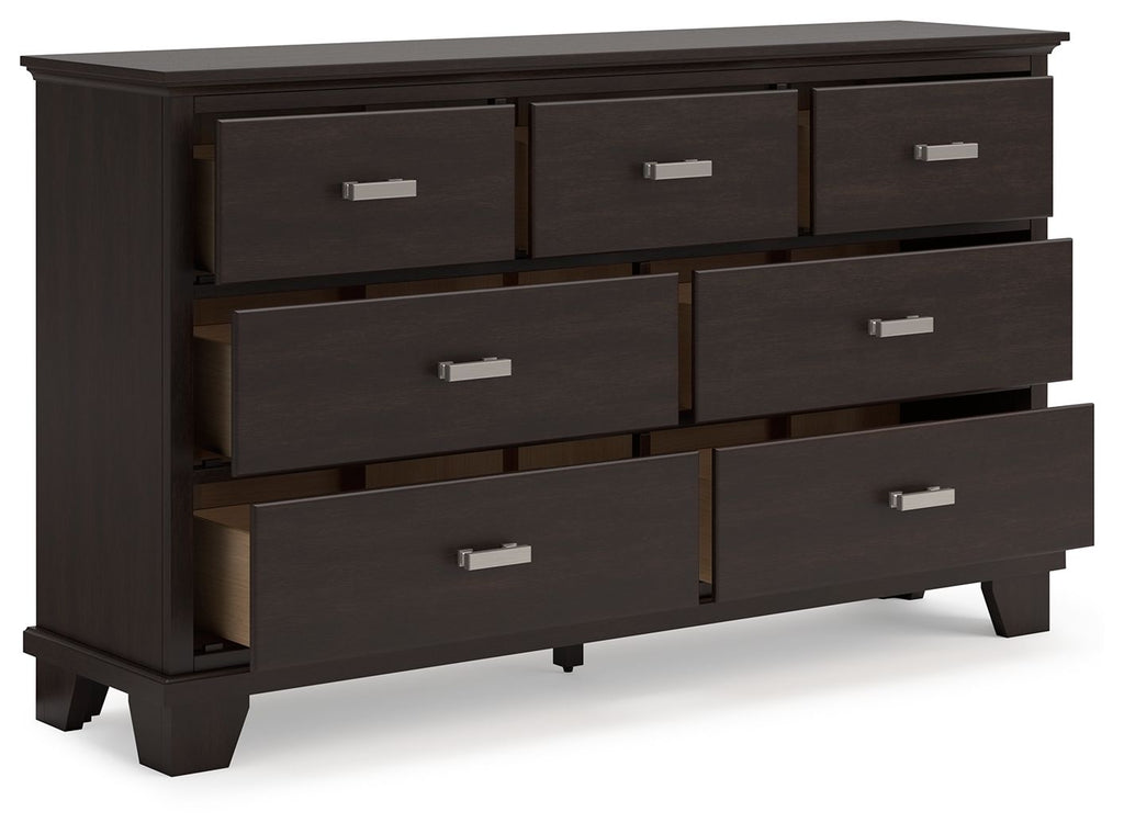 Dark brown dresser with open-front view of six drawers and silver bar handles