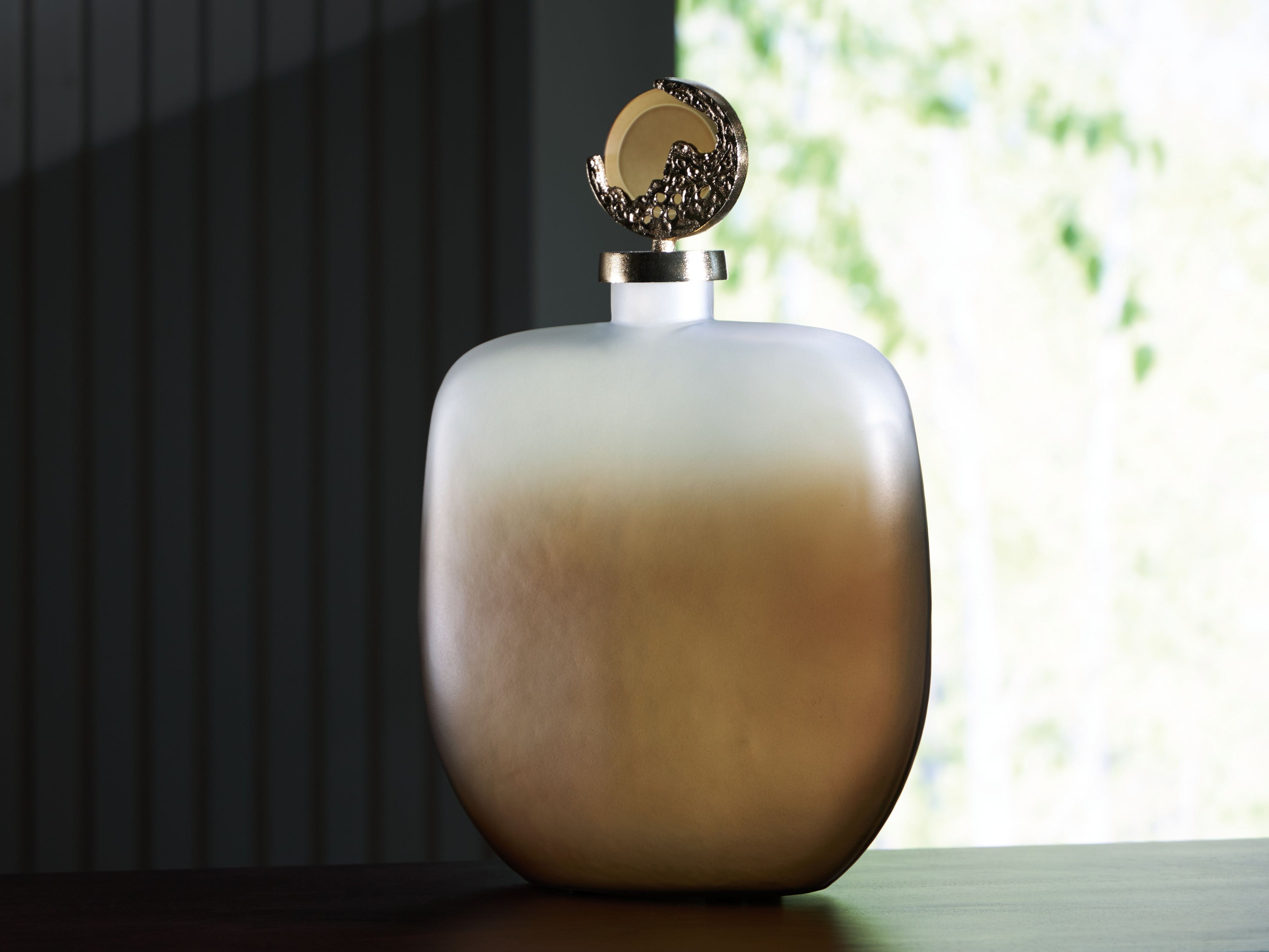 Decorative jar with frosted rounded body and gold-tone ornate hinged lid