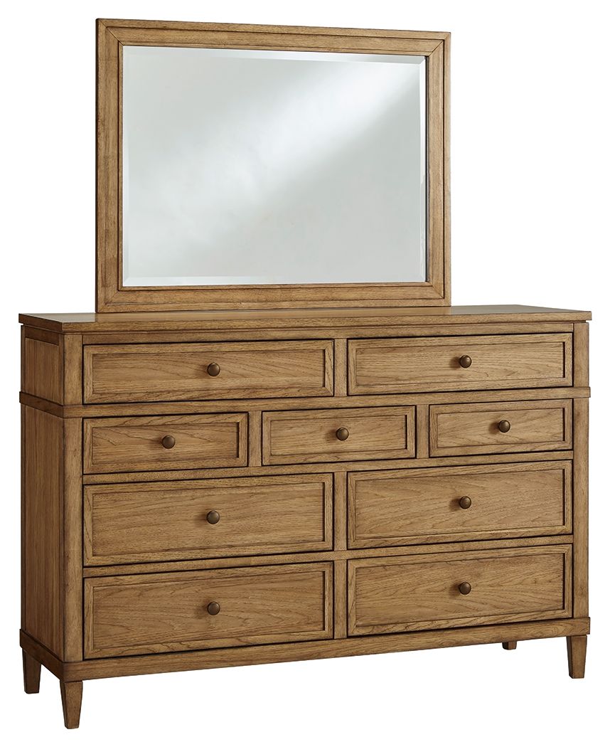 Light brown wood dresser with beveled mirror and multiple drawers, knob pulls