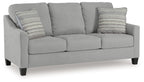 Light gray queen sofa sleeper with rounded arms and two striped throw pillows