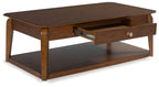 Rectangular cocktail table with open drawer, lower shelf, and medium brown wood frame