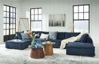 Navy modular sectional sofa with accent pillows and open chaise seating