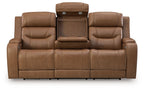 Light brown power reclining sofa with padded armrests and center console