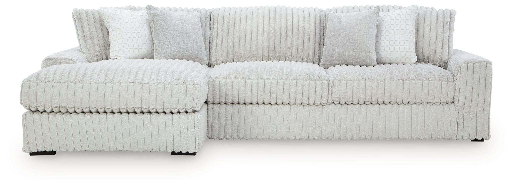 Sectional sofa with chaise, light-colored striped upholstery and padded arm cushions