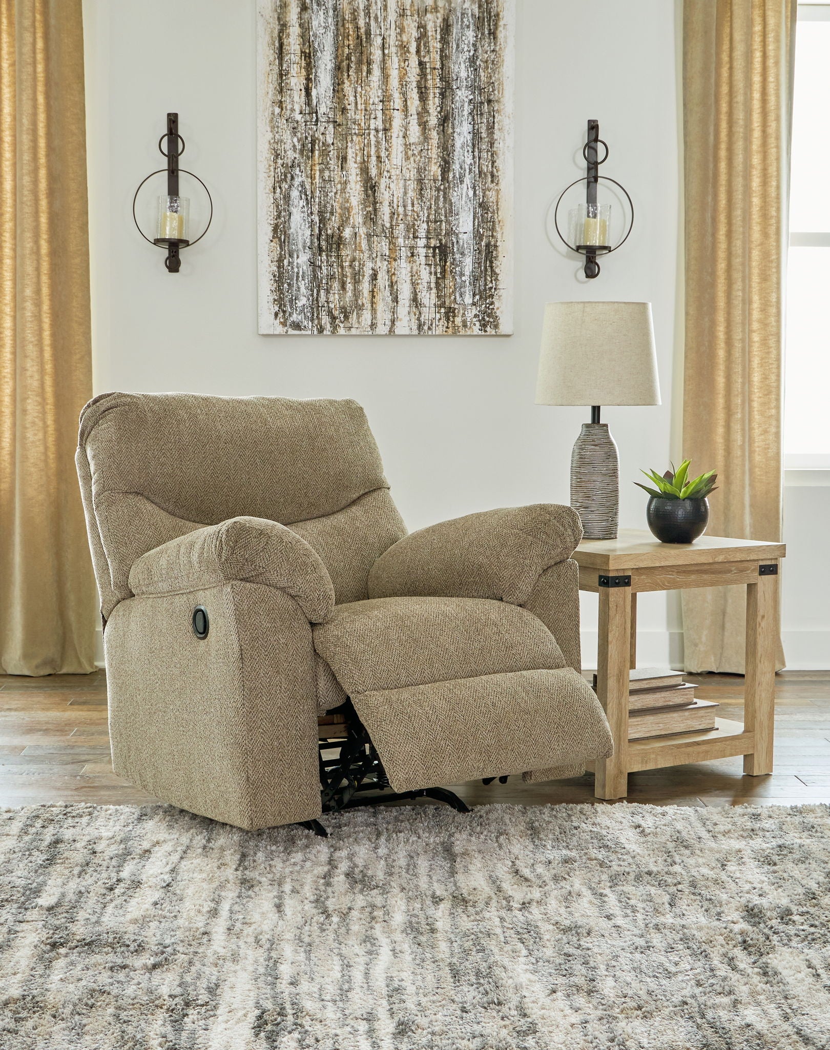 Taupe fabric reclining loveseat with padded arms and extended footrest
