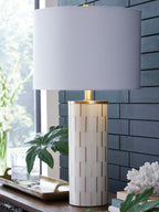 White poly table lamp with fabric shade and gold stem, ribbed cylinder body