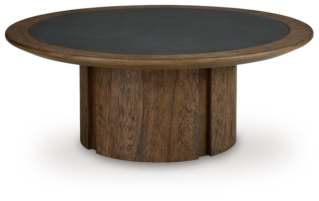Dontayne round table with dark top, rounded apron, and dark brown wood legs.