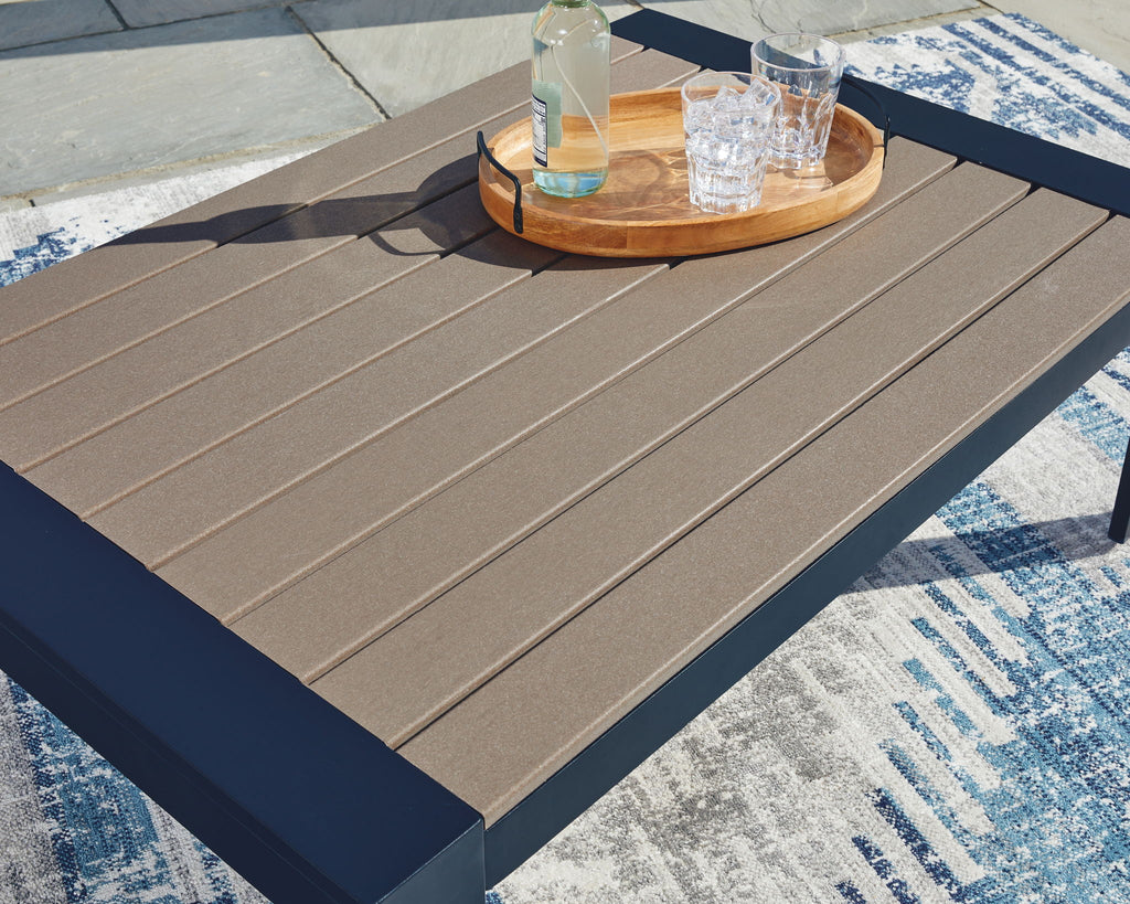 Blue rectangular cocktail table with slatted beige top and dark side rails