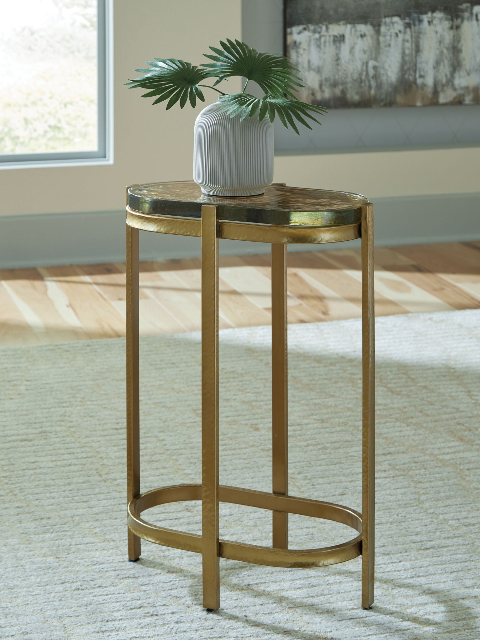 Gold-finish round accent table with open lower shelf and wood-look top