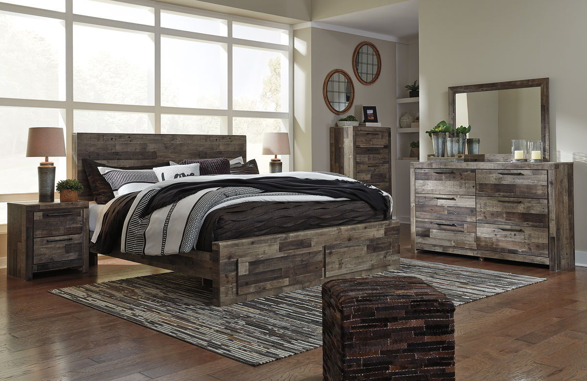 Panel bedroom set with panel bed, nightstands, dresser, and mirror in rustic gray wood.