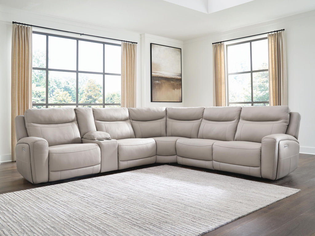 Gray power reclining sectional sofa with wide seats and corner chaise in living room