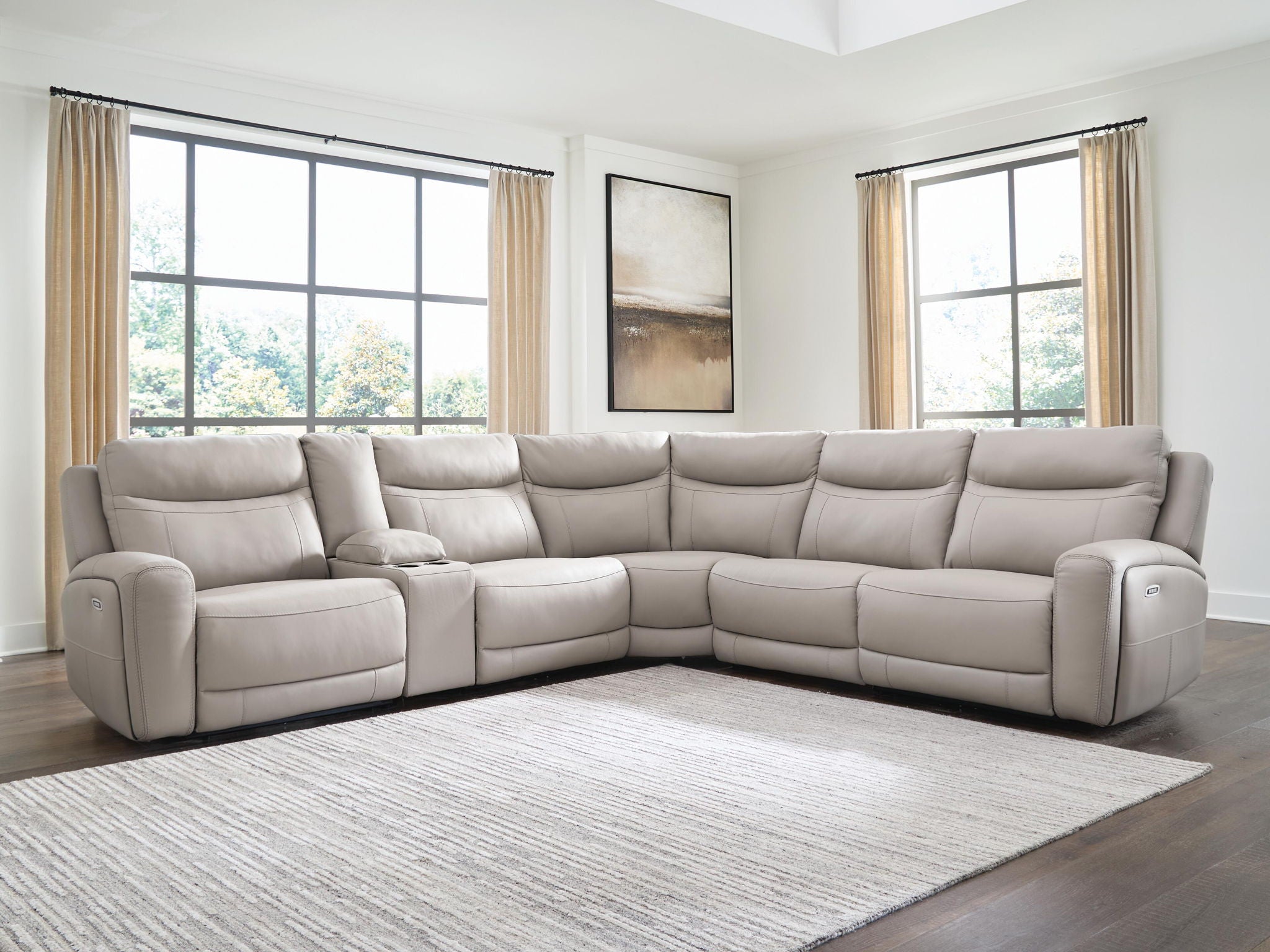 Gray power reclining sectional sofa with wide seats and corner chaise in living room