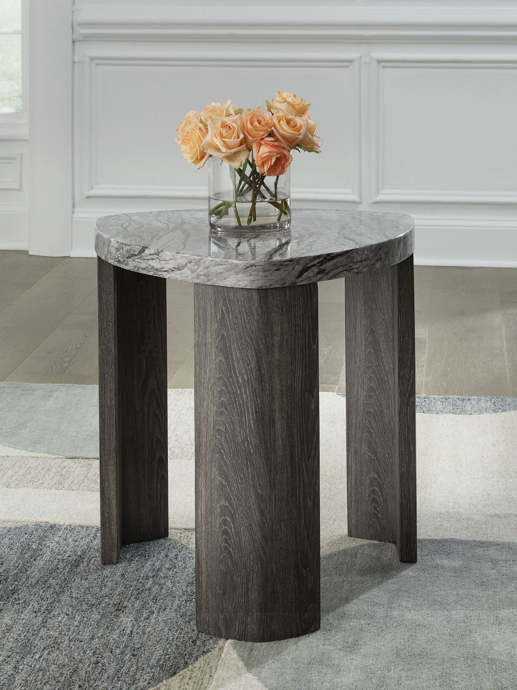 Gray marble-look triangle end table with flat top surface and dark wooden legs