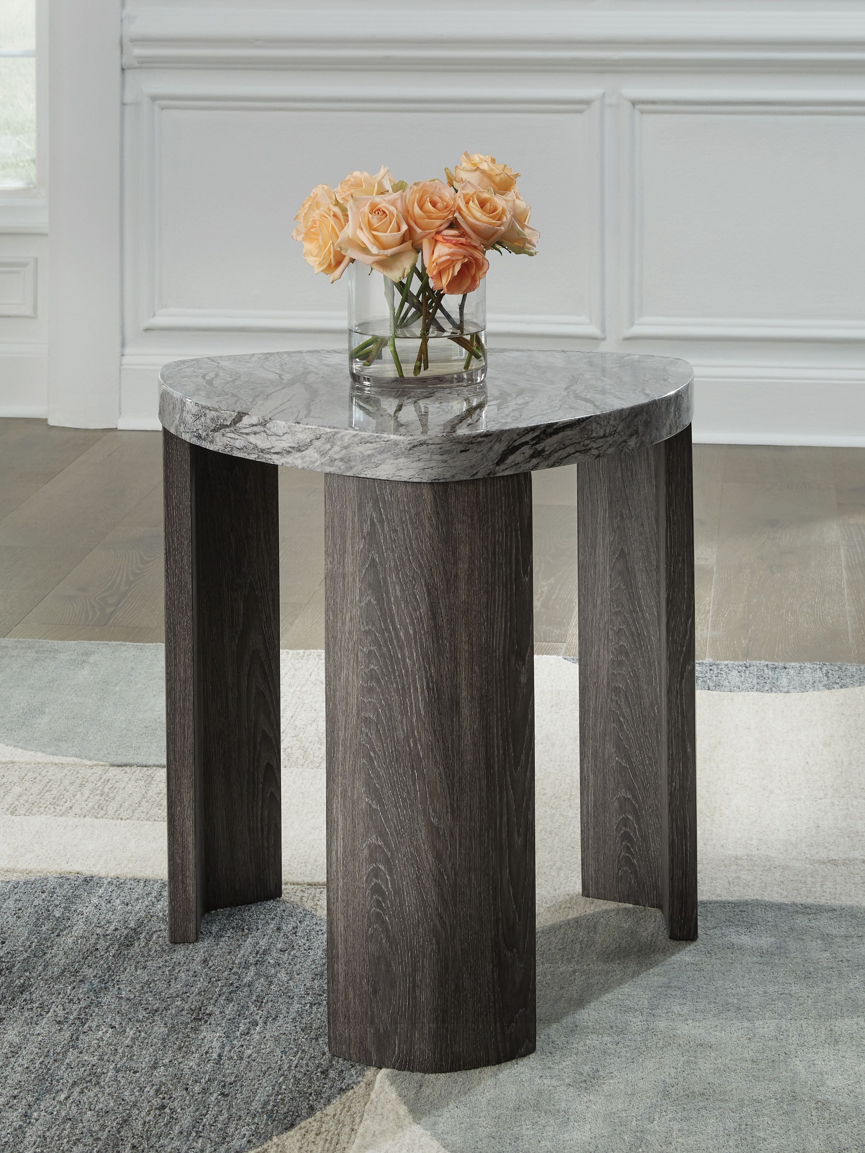 Gray marble-look triangle end table with flat top surface and dark wooden legs