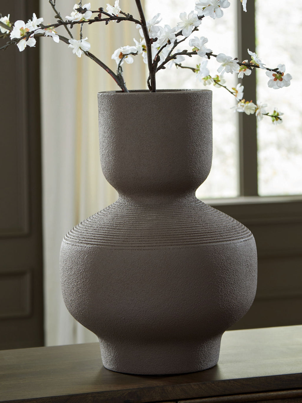 Dalsen vase in dark brown stoneware with textured surface and bulbous body.