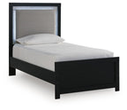 Upholstered panel bed with black frame, gray fabric headboard, light bedding