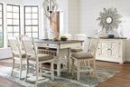 Beige dining table set with rectangular table, cushioned chairs, and buffet server