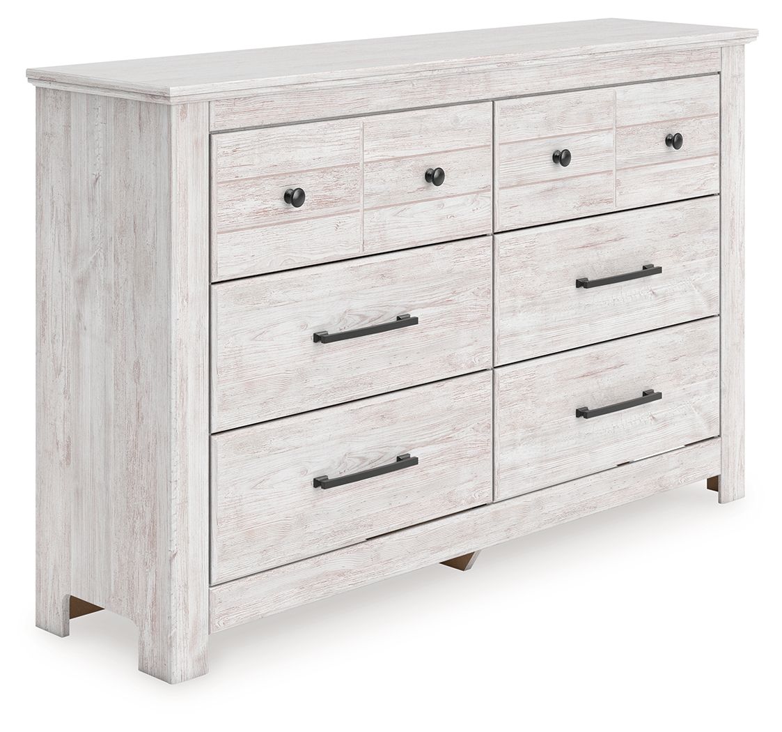 Whitewash six-drawer dresser with black bar pulls and round knobs on the top drawers