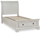 White sleigh bed with open slat base and two storage drawers in the footboard.