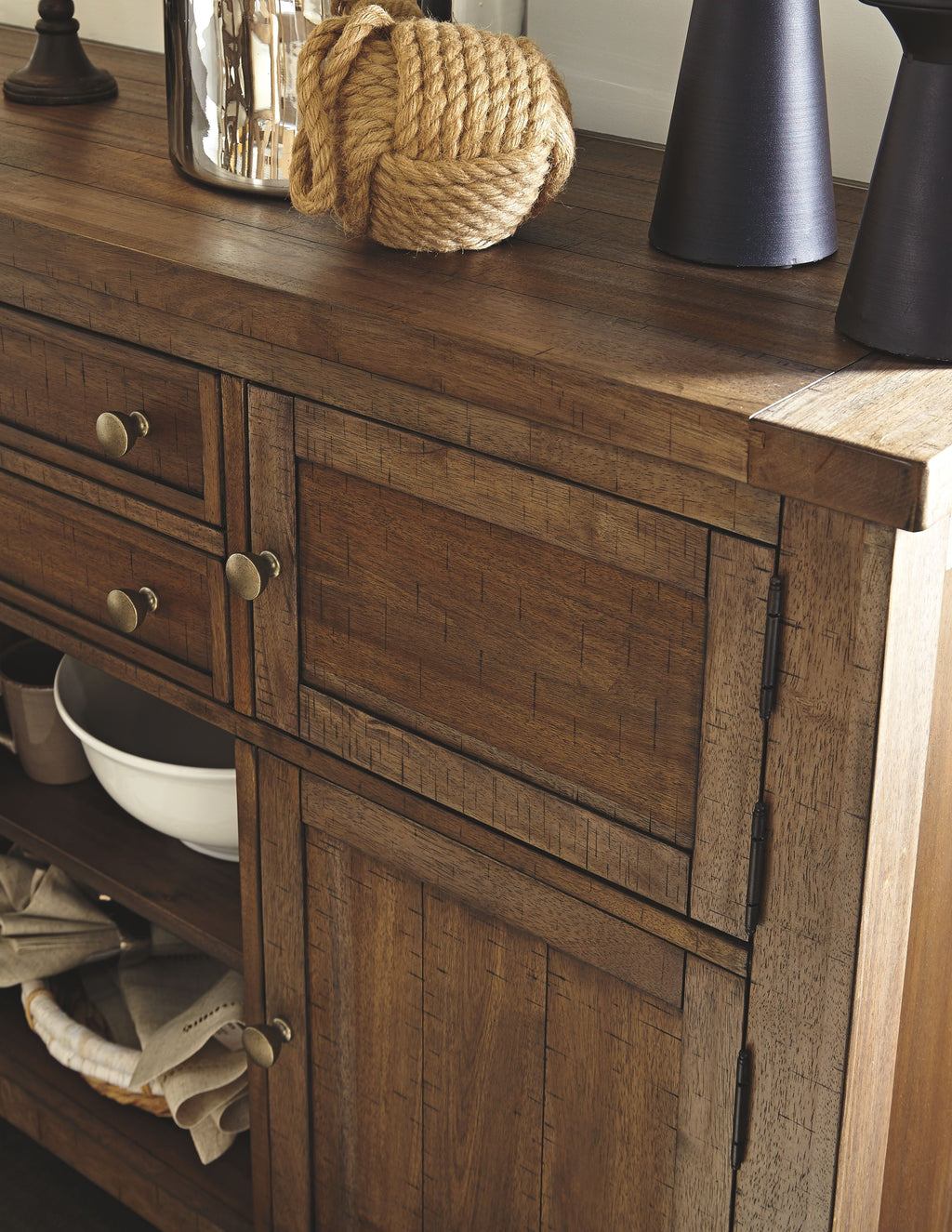 Wood server cabinet with drawers and doors, showing dark finish and metal knobs