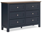 Brown-top blue dresser with six drawers and round silver knobs