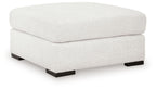 Oversized accent ottoman in chalk with cushioned rounded top and black base feet