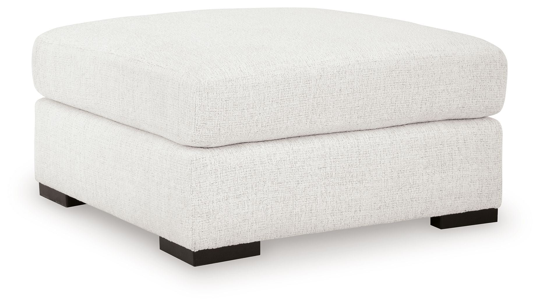 Oversized accent ottoman in chalk with cushioned rounded top and black base feet