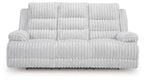 Reclining power sofa with drop-down table, light gray ribbed upholstery, cushioned front