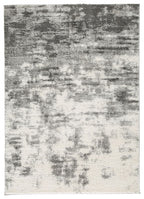 Rectangular pearl silver area rug with distressed abstract pattern and short pile