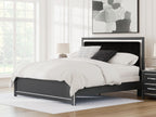 Upholstered panel bed with black headboard and white duvet, with stacked pillows
