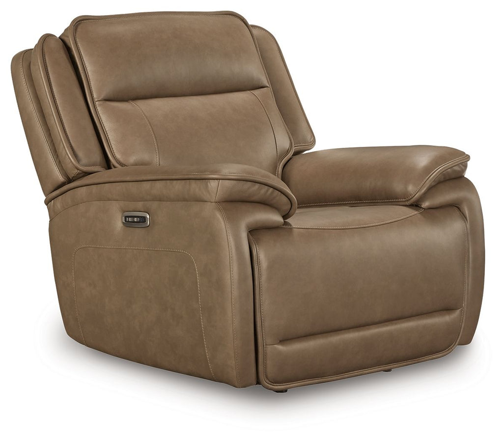 Brown power recliner chair with adjustable headrest and padded arms, side view