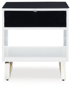 Rectangular end table with black top, white sides, open lower shelf, black drawer front