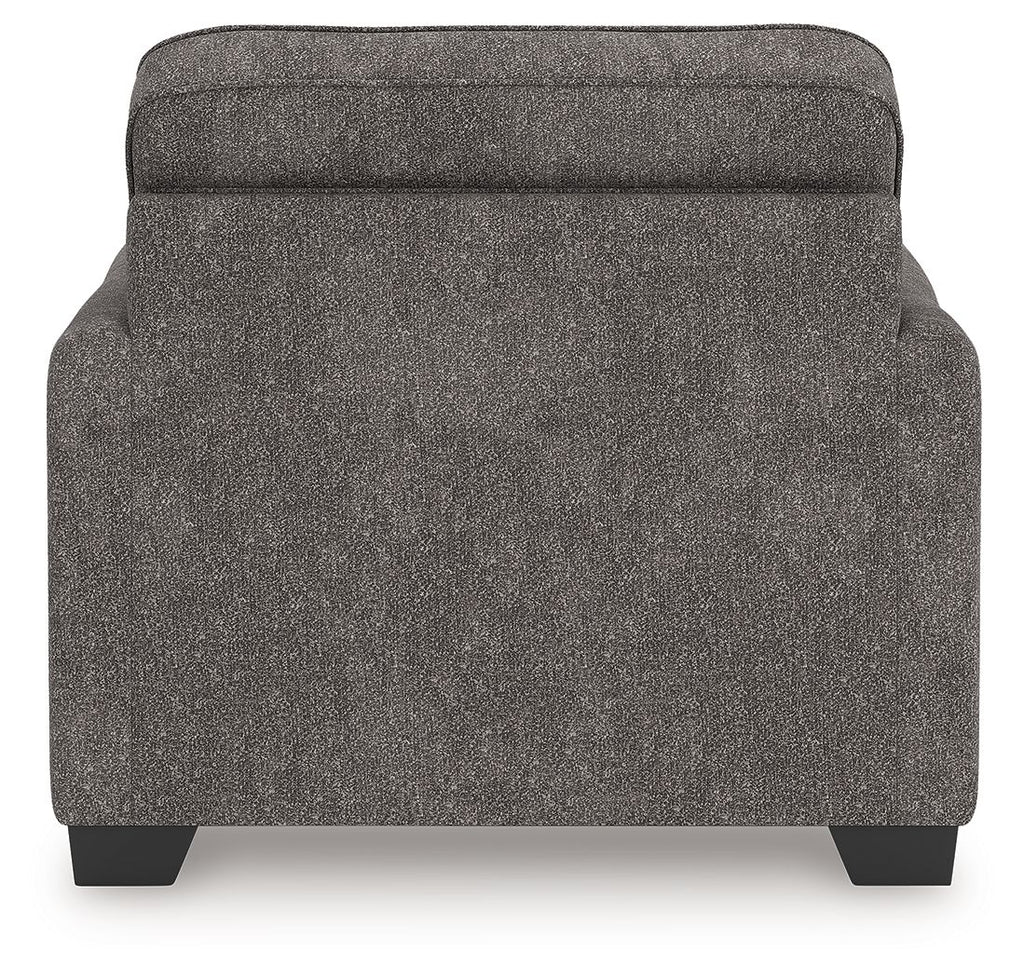 Dark gray upholstered chair and a half back panel with dark legs